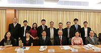 Mr. Tang Hao (third from the left in the front row) poses a group photo with other delegates and CUHK representatives